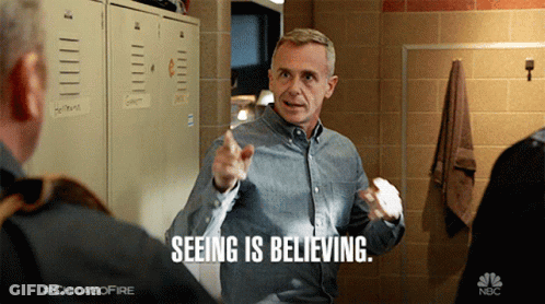 Man Saying Seeing Is Believing Pointing At Another Man GIF