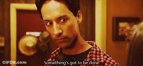 Man Saying Something In Front Of Red Door GIF