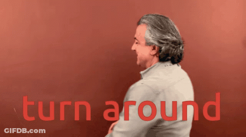 Man Saying Turn Around Red Background GIF