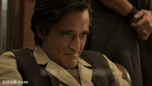 Man Saying Wow You're Smart Holding Glass GIF