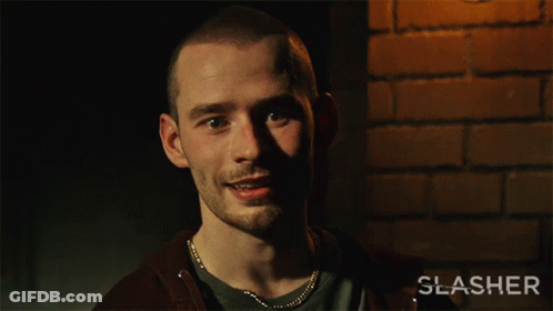 Man Saying Yeah In Front Of Slasher Poster GIF