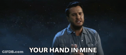 Man Saying Your Hand In Mine In Dark Room GIF
