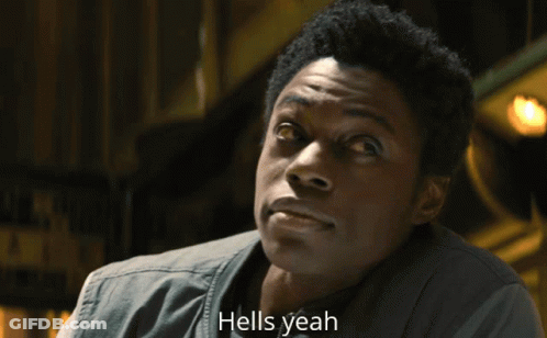 Man Says Hells Yeah In Front Of Yellow Background GIF