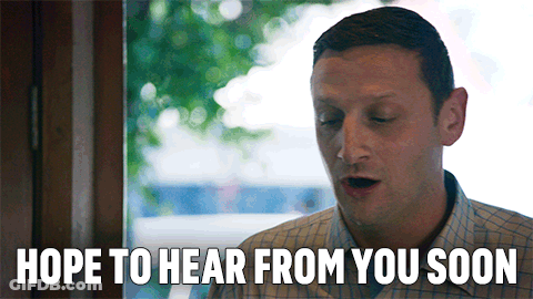 Man Says Hope To Hear From You Soon Looking Out Window GIF