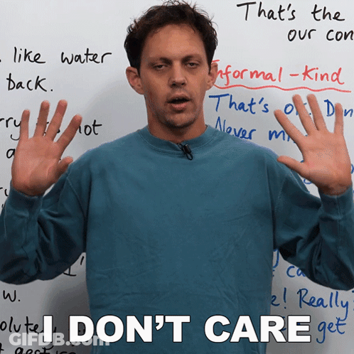 Man Says I Don't Care In Front Of Whiteboard GIF