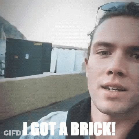Man Says I Got Brick In Front Of Building GIF