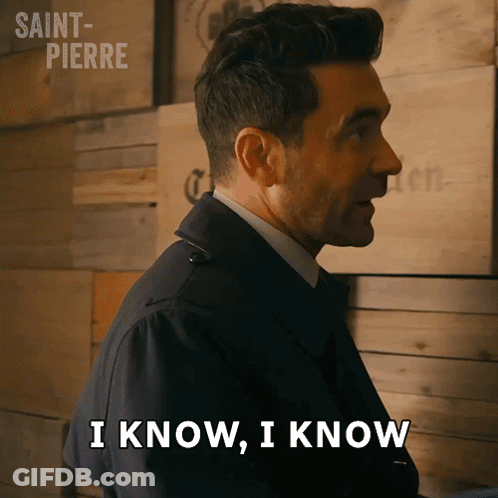 Man Says I Know I Know In Front Of Wooden Wall GIF