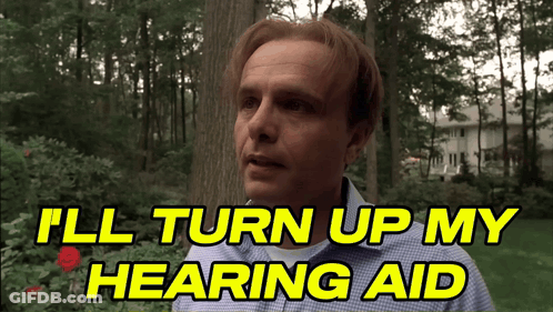 Man Says I'll Turn Up My Hearing Aid In Front Of Tree GIF