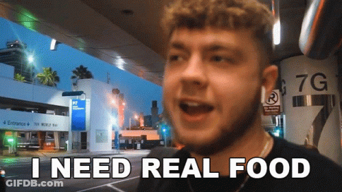 Man Says I Need Real Food In Front Of 7G Sign GIF