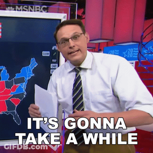 Man Says It's Gonna Take A While In Front Of Map GIF