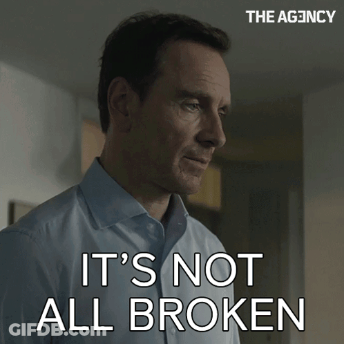 Man Says It's Not All Broken In Front Of The Agency Sign GIF