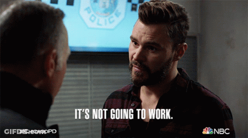 Man Says It's Not Going To Work In Front Of Police Sign GIF