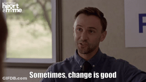 Man Says Sometimes Change Is Good In Front Of Heart & Home Sign GIF