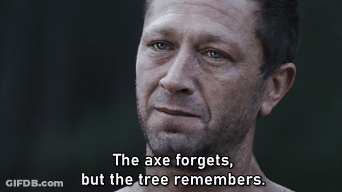 Man Says The Axe Forgets But The Tree Remembers In Dark Room GIF