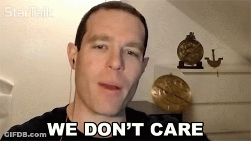 Man Says We Don't Care In Front Of Clock GIF