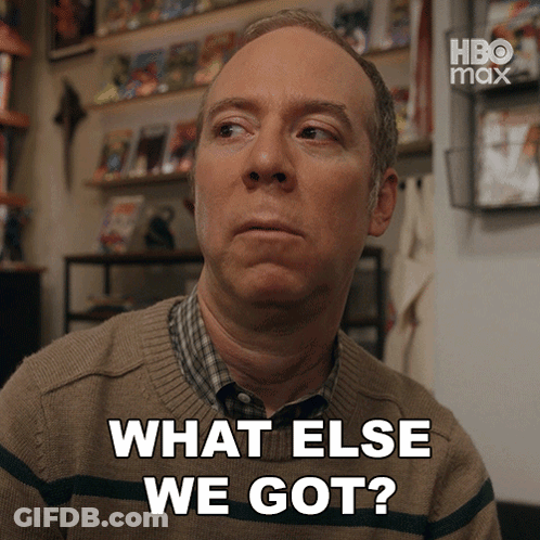 Man Says What Else We Got In Front Of Bookshelf GIF
