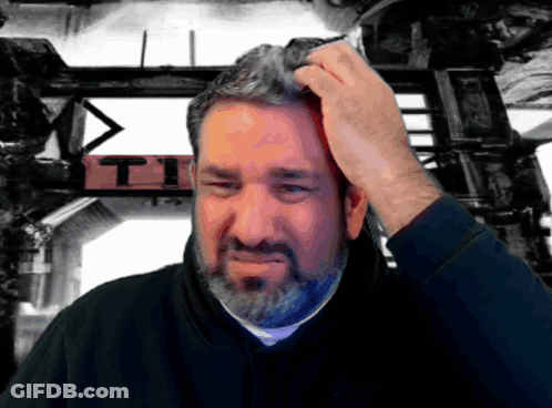 Man Scratching Head In Front Of T.I. Sign GIF
