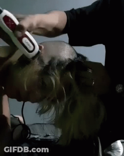 Man Shaving Another Man's Head With Trimmer GIF