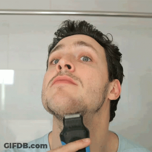 Man Shaving Beard With Razor In Mirror GIF