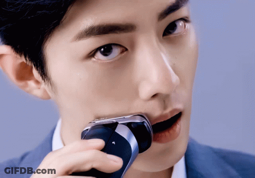 Man Shaving Face With Philips Razor GIF