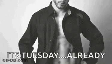 Man Shirtless In Front Of Its Tuesday Sign GIF