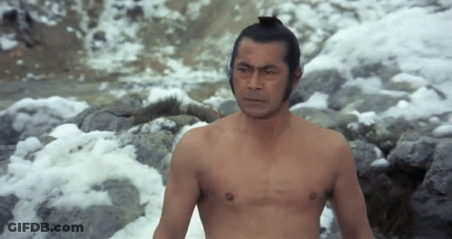 Man Shirtless Standing By Snowy River GIF