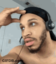 Man Shirtless Wearing Headphones Making Funny Face GIF