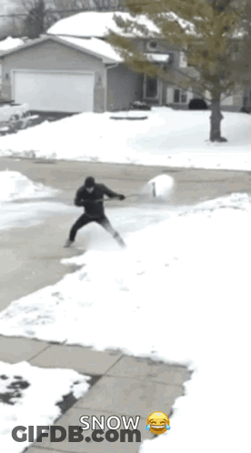 Man Shoveling Snow With Smiley Snow Sign GIF