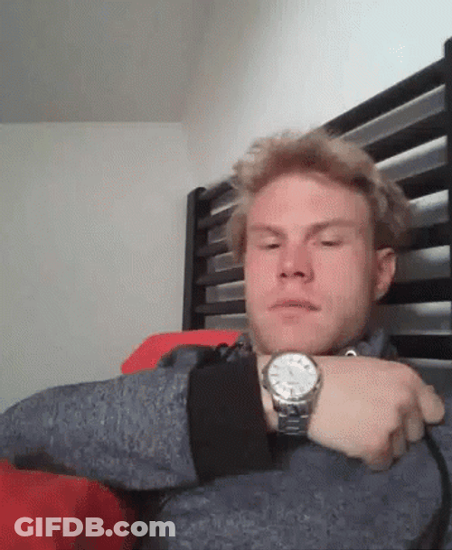 Man Showing Watch While Tongue Out GIF