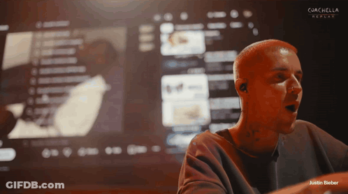 Man Singing In Front Of Coachella Screen GIF