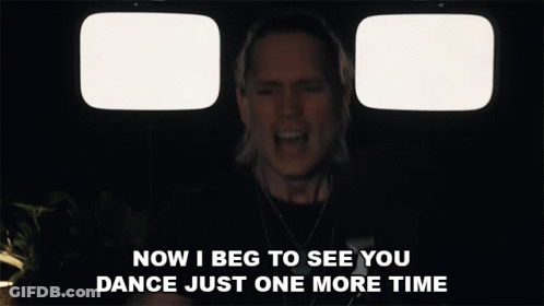 Man Singing In Front Of Two Televisions Saying Now I Beg To See You Dance Just One More Time GIF