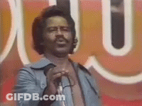 Man Singing Into Microphone At Sign Saying U GIF
