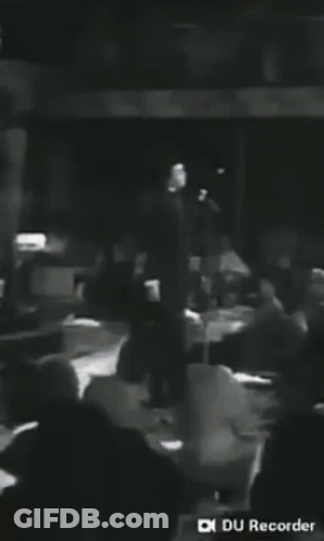 Man Singing Into Microphone Black And White GIF