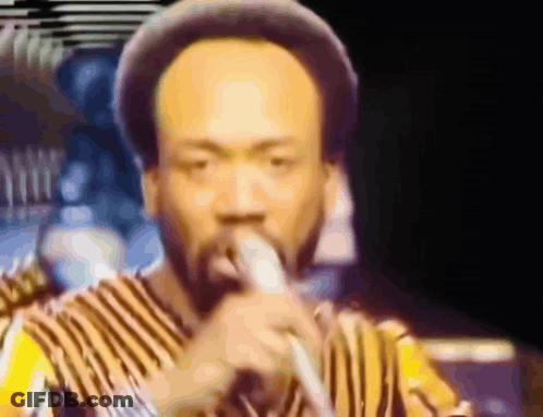 Man Singing Into Microphone GIF