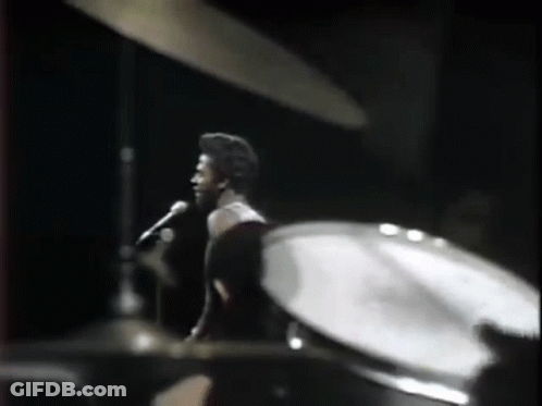 Man Singing Into Microphone Drums GIF