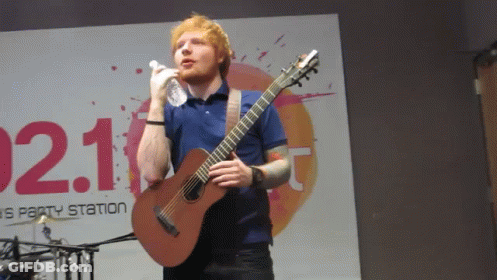 Man Singing Into Microphone Holding Guitar 021 GIF