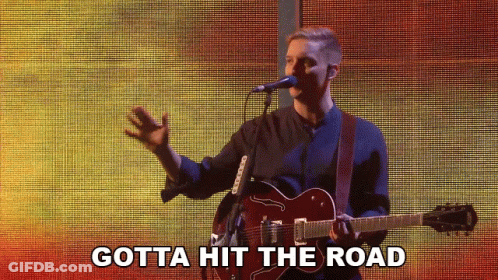 Man Singing Into Microphone Holding Guitar Gotta Hit The Road GIF