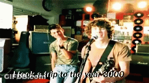 Man Singing Into Microphone I Took A Trip To The Year 3000 GIF