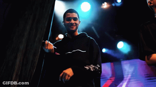 Man Singing Into Microphone In Black Hoodie GIF