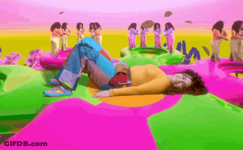 Man Singing Into Microphone In Blue And Yellow Outfit GIF