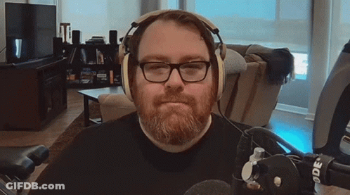Man Singing Into Microphone In Blue Jacket GIF