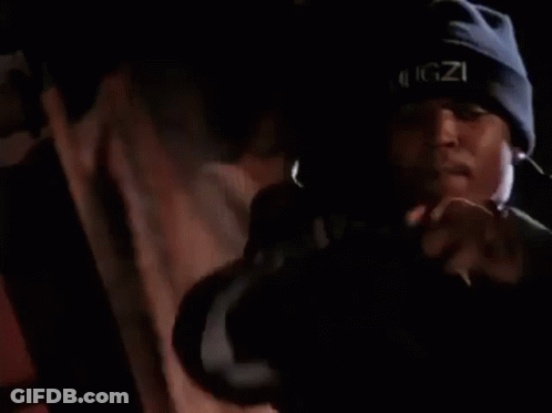 Man Singing Into Microphone In Dark Room GIF