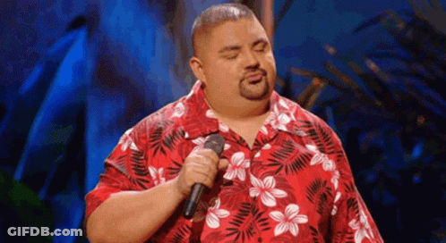 Man Singing Into Microphone In Red Hawaiian Shirt GIF