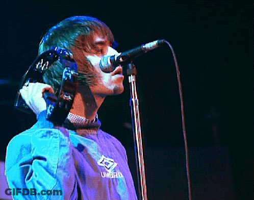 Man Singing Into Microphone In Umbro Jacket GIF