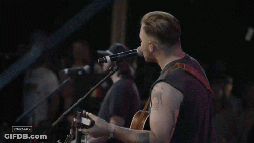 Man Singing Into Microphone GIF