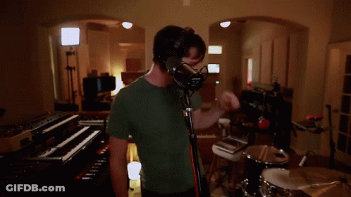 Man Singing Into Microphone GIF