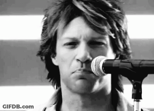 Man Singing Into Microphone Making Face GIF