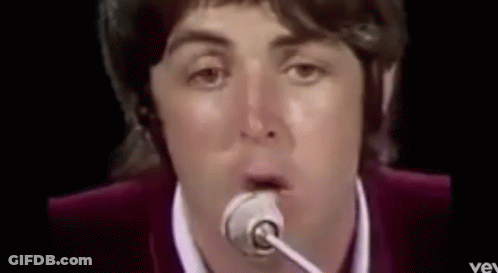 Man Singing Into Microphone Making Funny Face GIF