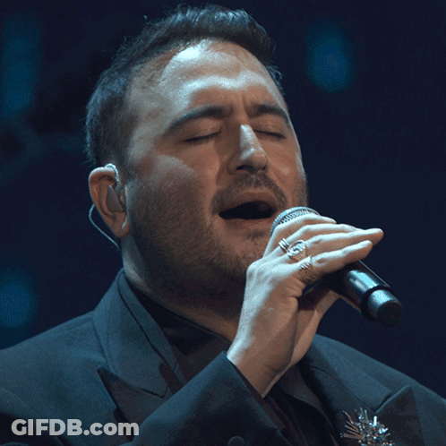 Man Singing Into Microphone GIF