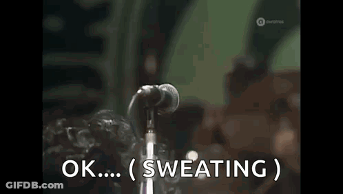 Man Singing Into Microphone Ok Sweating GIF